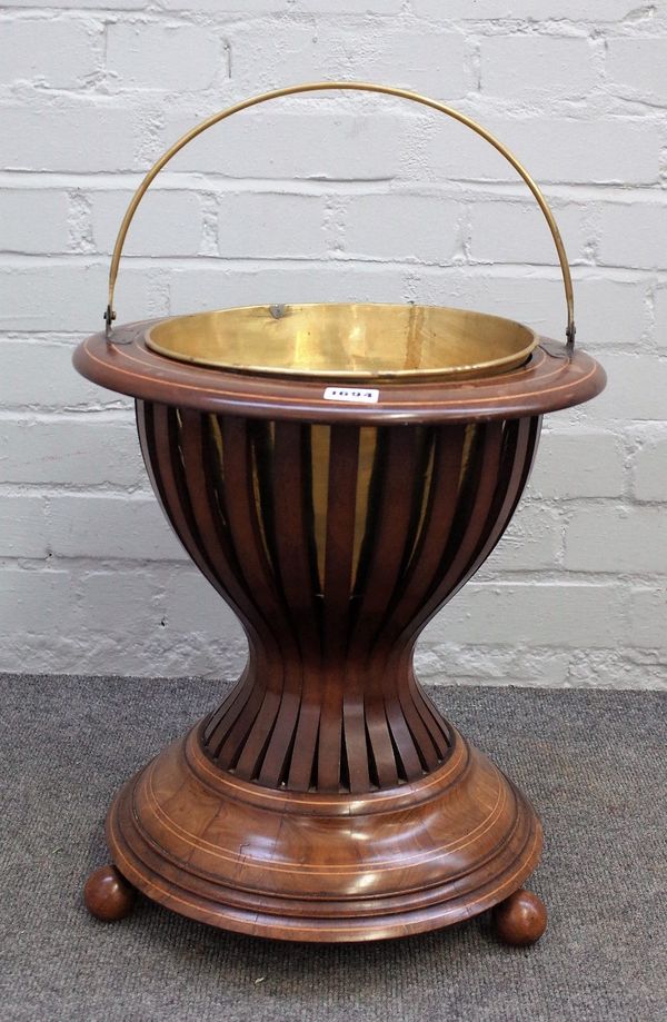 A 19th century Dutch inlaid walnut jardinaire with open slatted body on four spherical supports, 39cm diameter x 42cm high.