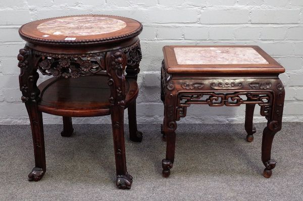 A 19th century Chinese carved hardwood circular two tier jardiniere stand with marble inset top, 52cm diameter x 57cm high, together with a similar re