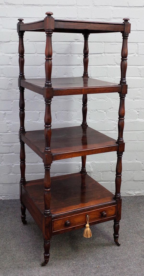 A Victorian rosewood four tier what-not with single drawer base on turned supports, 46cm wide x 126cm high.