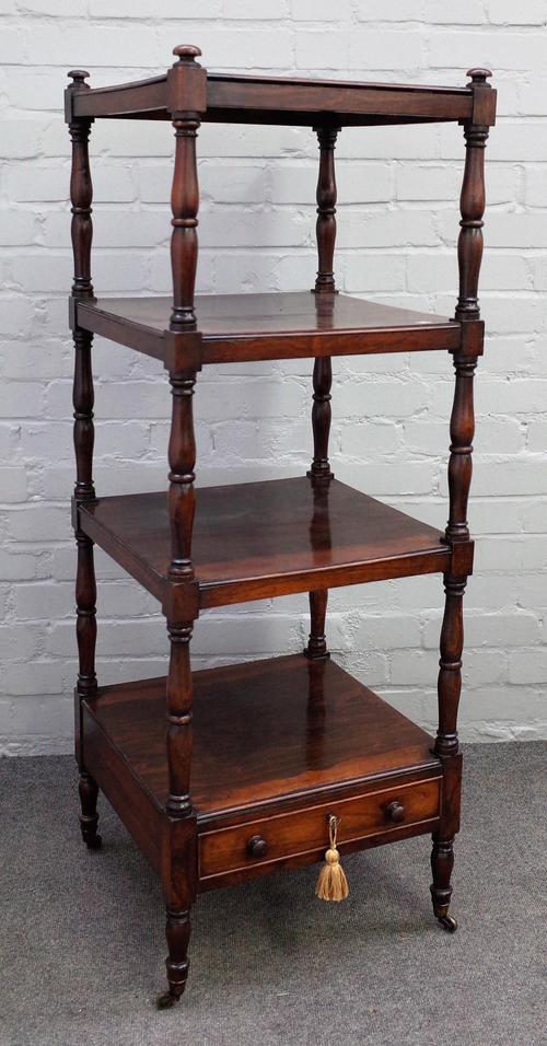 A Victorian rosewood four tier what-not with single drawer base on turned supports, 46cm wide x 126cm high.
