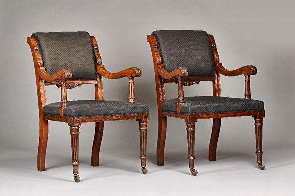 A pair of 19th century mahogany framed open armchairs, with acanthus capped arms and straight front seats, on ebonised fluted supports, 60c, wide x 95