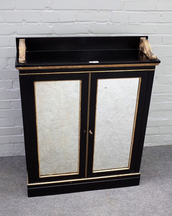 A Victorian parcel gilt ebonised chiffonier with pair of mirrored doors and grille sides, 81cm wide x 102cm high.