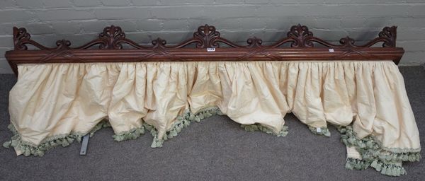 A William IV mahogany half tester canopy frame, with ribbon tied reeded frame and carved anthemion decoration, 165cm wide x 37cm deep.