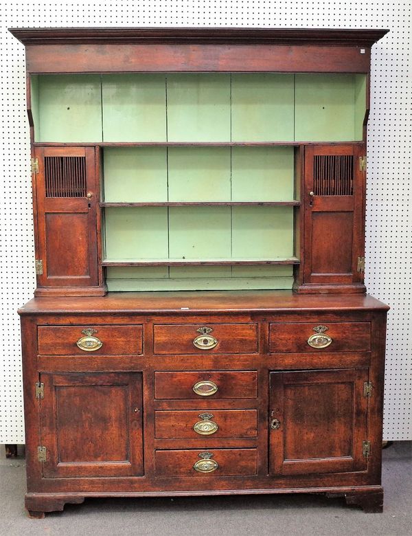 An 18th century oak dresser, the enclosed three tier plate rack with a pair of food cupboards with slatted panels , the base with six short drawers an