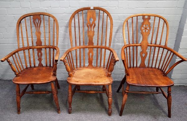 Two 19th century ash and elm Windsor chairs, on turned supports, 65cm wide x 103cm high, together with a similar beech and elm chair, (3).