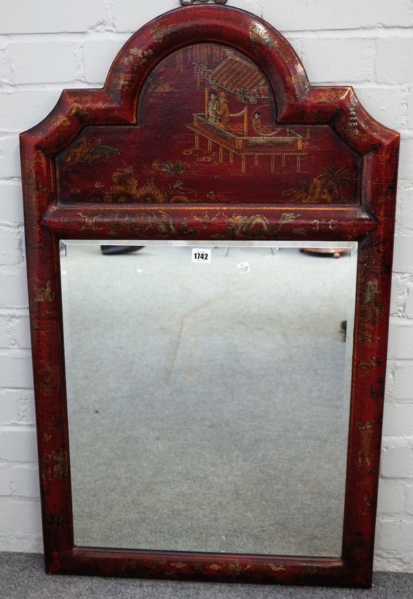 A 20th century scarlette lacquered arch top mirror of 17th century design, decorated with Eastern figures and landscapes, 61cm wide x 107cm high.