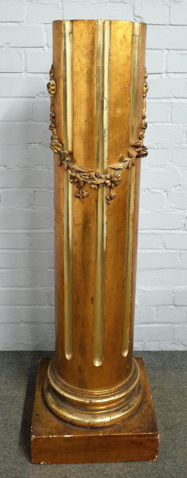 A 20th century gold painted column, the fluted body with ribbon tied floral swag, on a square base, 35cm wide x 120cm high.