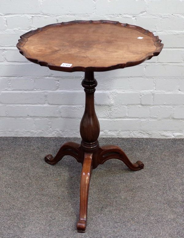 A 19th century occasional table, the shaped circular top on baluster column and tripod base, 52cm wide x 67cm high.