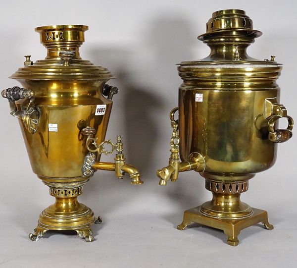 A Russian brass samovar with twin handles and tap, 51cm high and another similar brass samovar, (2).  D4