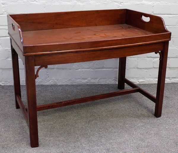 A 19th century mahogany bowfront butlers tray with loop handles, on later stand, 76cm wide x 57cm high.