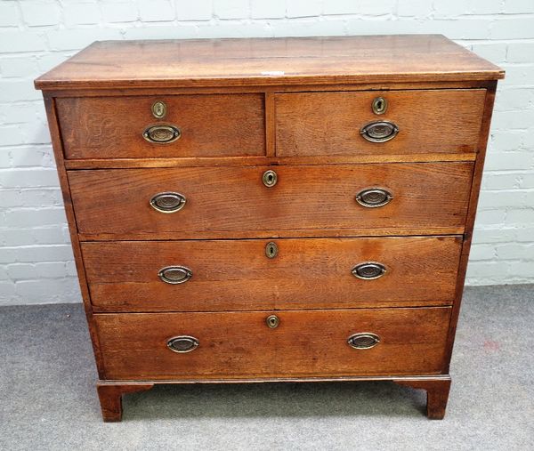 A mid-18th century oak chest of two short and three long graduated drawers on bracket feet, 103cm wide x 103cm high.