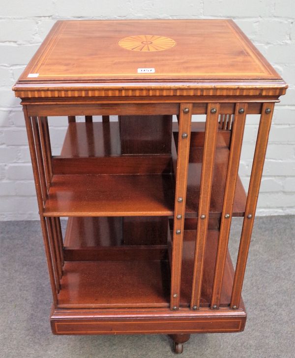 A late 19th century inlaid mahogany square revolving bookcase, 50cm wide x 56cm high.