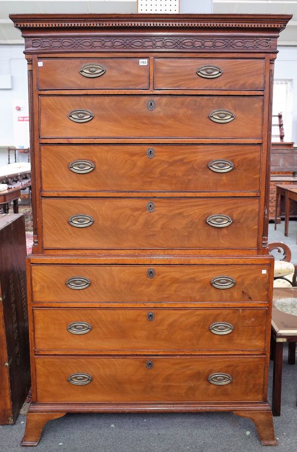 A George III mahogany chest on chest, with two short over six long graduated drawers, flanked by fluted corners, on splayed bracket feet, 113cm wide x