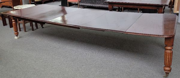 An early Victorian mahogany extending dining table on turned and reeded supports, three extra leaves, 129cm wide x 124cm long x 356cm long extended.