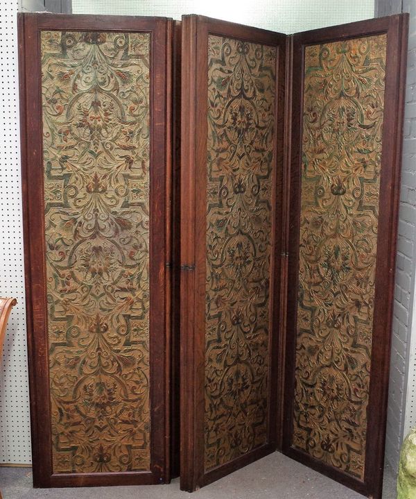 A 19th century oak framed five fold draught screen, inset with embossed polychrome painted leather panels, 315cm wide x 208cm high.