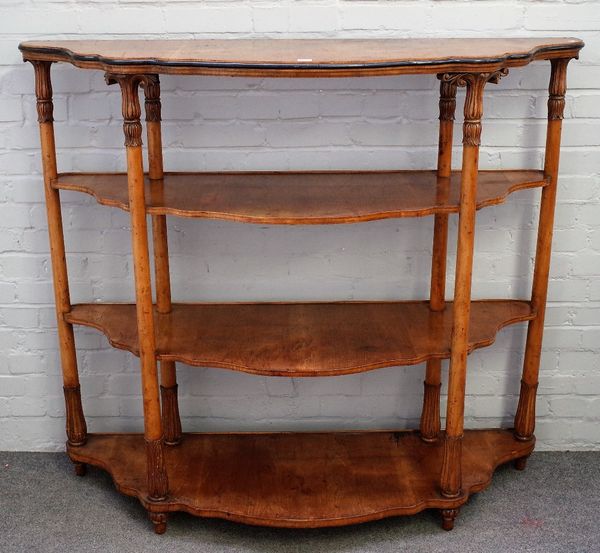 A large 19th century fruitwood Continental serpentine four tier etagere, on turned supports, 145cm wide x 129cm high.