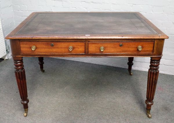 A William IV mahogany writing table, the leather inset rectangular top with pair of frieze drawers and dummy verso, on reeded supports, 122cm wide x 7