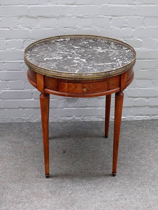 A late 19th century French gueridon, the galleried circular marble top over pair of frieze drawers on tapering turned supports, 64cm diameter x 74cm h