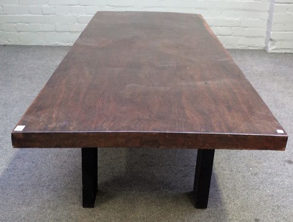 A 19th century Eastern low table, the single slab rectangular hardwood top, on four later block supports, the top 76cm wide x 202cm long x 5.5cm thick