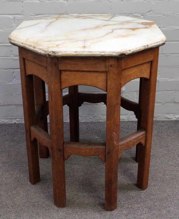 An onyx topped octagonal side table, on an Arts and Crafts oak stand, 61cm wide x 70cm high.