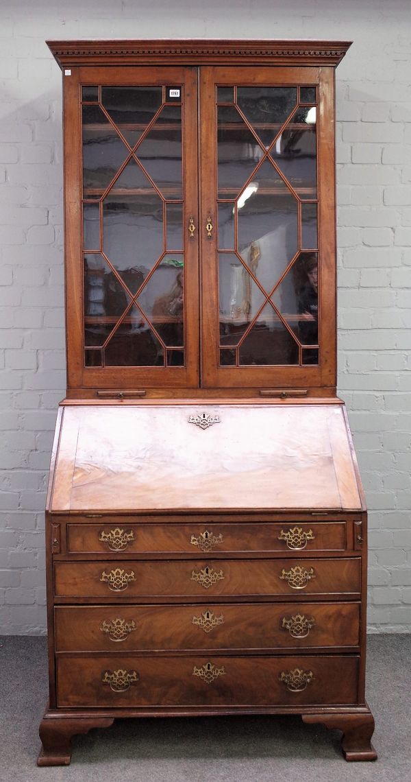 A mid-18th century mahogany bureau bookcase, with a pair of astragal glazed doors over fitted interior and four long graduated drawers, on bracket fee