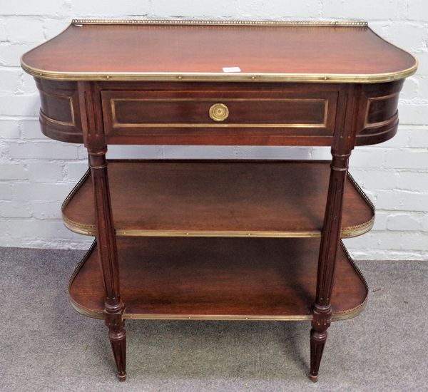 An early 20th century French brass mounted mahogany three tier side table, with single frieze drawer, on fluted supports, 75cm wide x 84cm high.  A/S