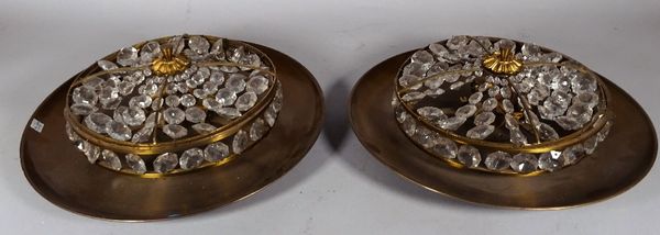 A pair of modern gilt metal circular ceiling lights of shallow dished form, the centre decorated with a cut crystal circlet and foliate finial, 45cm d