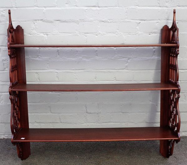 A set of mahogany hanging wall shelves, with pierced fret sides, 94cm wide x 92cm high.