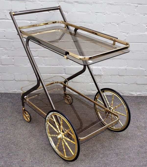 A 20th century lacquered brass and smoked glass two tier drinks trolley, 70cm wide x 81cm high.