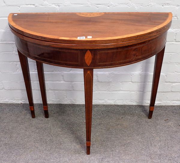 A George III inlaid mahogany semi-elliptic tea table, on tapering square supports, 91cm wide x 73cm high.