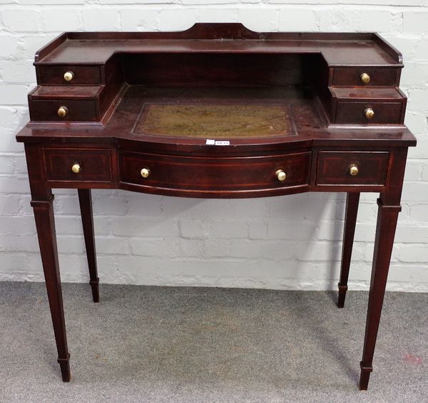 An Edwardian mahogany writing desk, the stepped four drawer superstructure over three frieze drawers, on square tapering supports, 92cm wide x 92cm hi