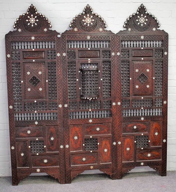 An early 20th century North African mother-of-pearl inlaid hardwood three fold screen, with bobbin turned decoration, 180cm wide x 198cm high x 2cm de