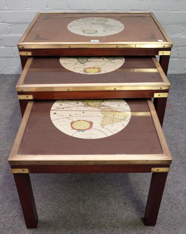 A nest of three brass bound mahogany tables, of campaign design, on block supports, the larger 64cm wide x 45cm high.