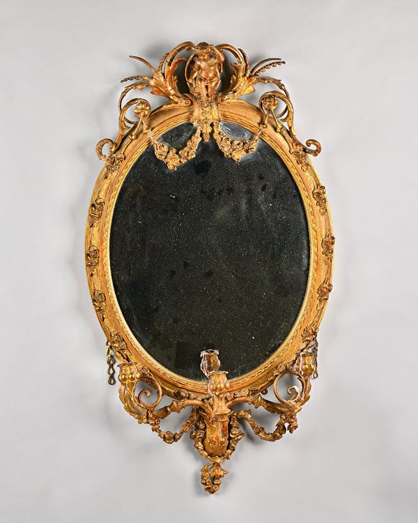 A 19th century gilt framed girandole mirror, with cherub crest and triple branch lower frieze, 61cm wide x 112cm high. Illustrated.