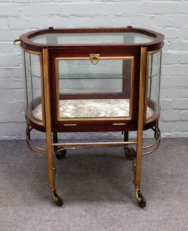 An unusual early 20th century French stained beech and brass freestanding display cabinet of rounded rectangular form, 74cm wide x 79cm high.