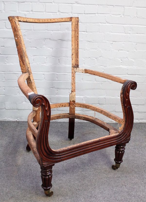 A Regency mahogany chair frame, with outswept acanthus scroll arms on tapering reeded supports, 72cm wide x 106cm high.