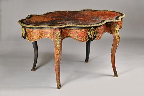 A 19th century gilt metal mounted ebonised boulle work centre table, the serpentine top over frieze drawer on cabriole supports, 150cm wdie x 77cm hig