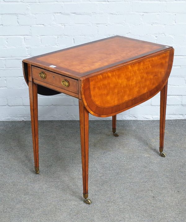 A George III mahogany banded satinwood Pembroke table, on tapering square supports, 77cm wide x 72cm high.