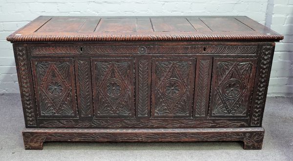 A large 18th century oak coffer, with four panel lid over carved front, 160cm wide x 78cm high.