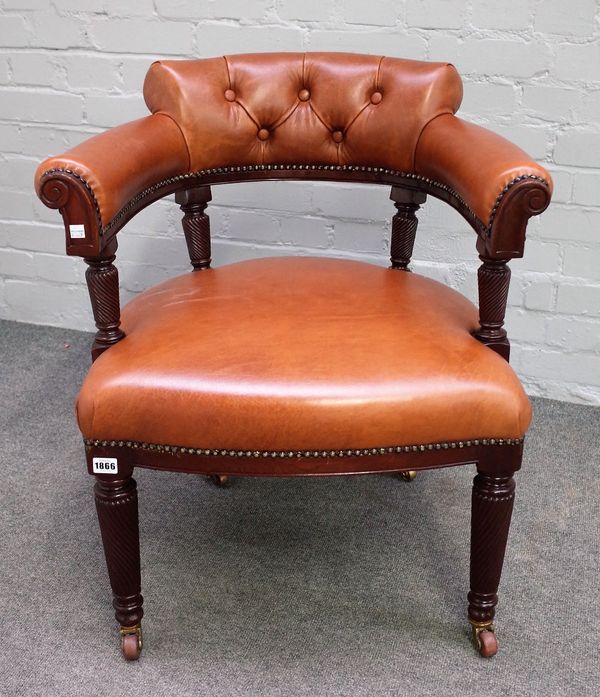 A 19th century tub back office chair, with studded tan leather upholstery, on spiral fluted mahogany supports, 67cm wide x 74cm high.