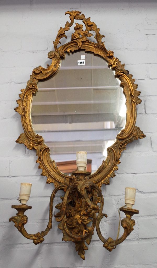 A 19th century gilt framed girandole wall mirror with asymmetric opposing 'C' scroll frame over triple branch, 52cm wide x 98cm high.