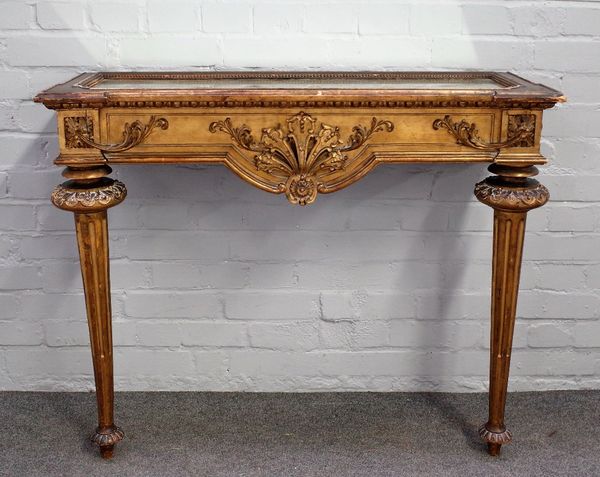 A Louis XVI style gilt framed console table with mirrored top over carved frieze on tapering fluted supports, 101cm wide x 83xm high.