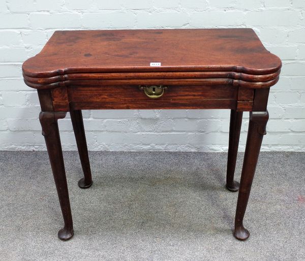 A mid-18th century mahogany triple fold-out tea and games table, with single frieze drawer, on pad feet, 80cm wide x 74cm high.