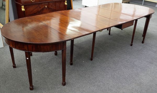 A 19th century 'D' end extending dining table with central drop flap section and two extra leaves on tapering square supports, 122cm wide x 350cm long