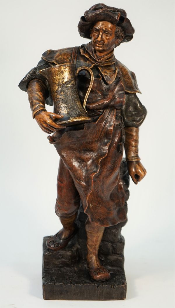 A Goldscheider terracotta figure of an inn keeper holding a large jug of ale, Ltd edition 22/73, plaque and foundry stamp to rear, 52cm high.