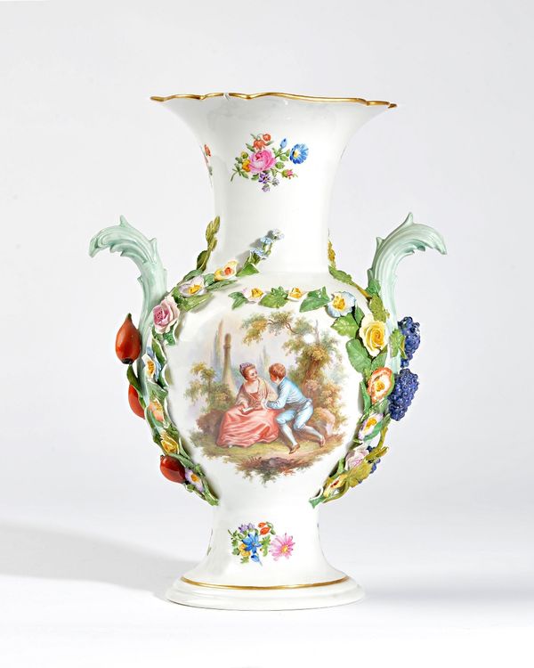 A Meissen porcelain two-handled baluster vase, circa 1900, set with leaf moulded handles, painted on one side with two lovers in a landscape, the reve