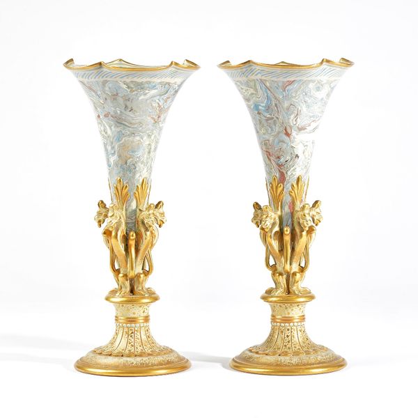 A pair of Doulton Lambeth Marqueterie ware vases, circa 1890, of trumpet form supported by five griffins, raised on a spreading foot, impressed factor