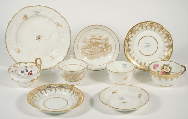 A group of Swansea porcelain, circa 1820, comprising; a teacup and two saucers, the interior of the cup painted with flowers and strawberries probably