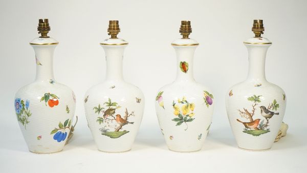 Four Herend porcelain table lamps, each decorated with  floral and fauna against a basket weave ground, 28.5cm high, (4).