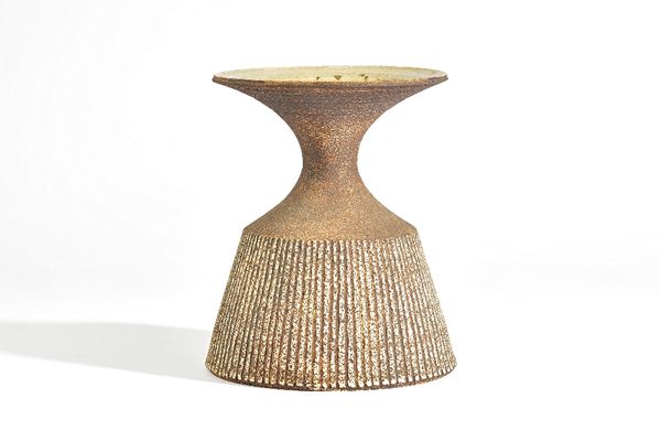 Waistel Cooper ( 1921-2003), a stoneware vase or lamp base, the sides incised with vertical lines beneath a waisted neck and everted rim, signed, 22.7